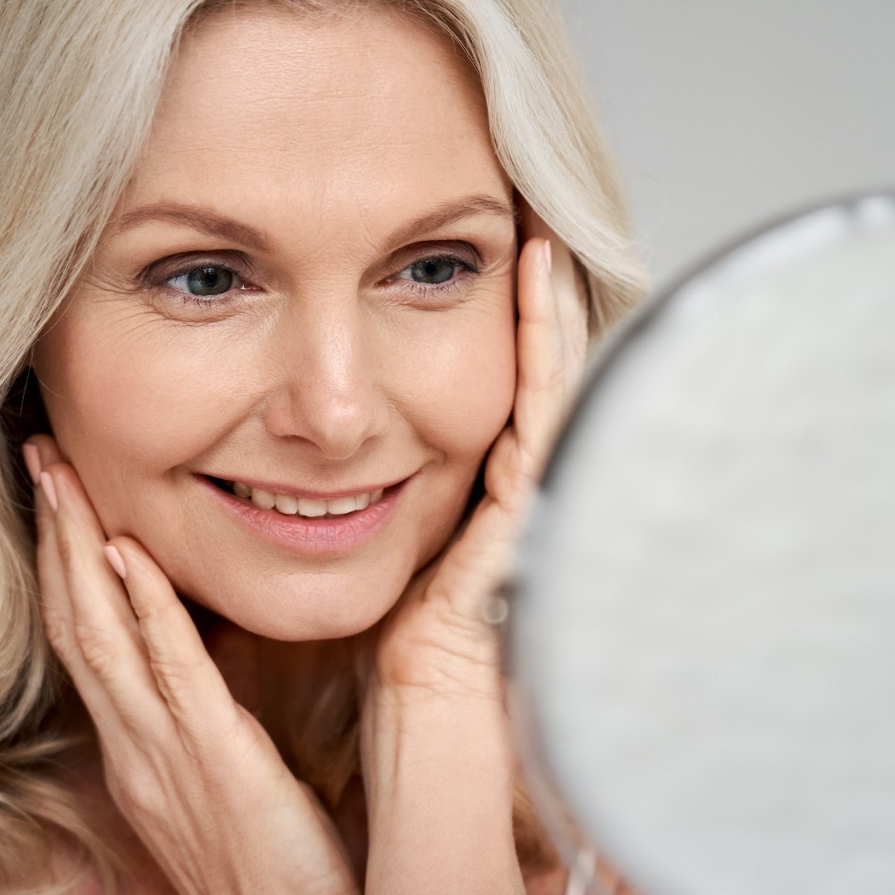 A woman reviewing a non-surgical facial rejuvenation plan